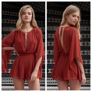 the jetset diaries ara romper bell sleeve sheer romper rust orange
